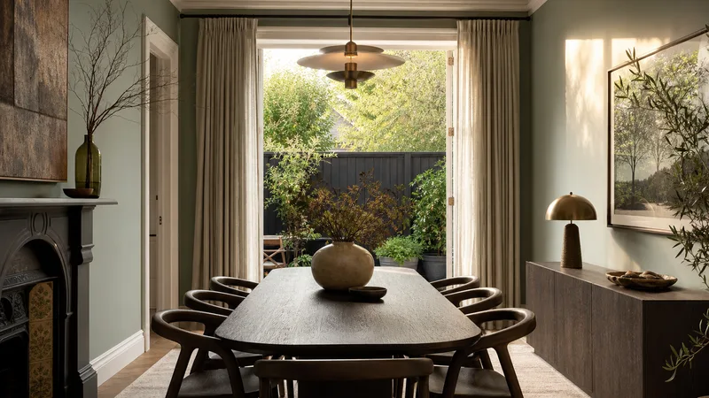 Staged dining room opening to a leafy Armadale courtyard